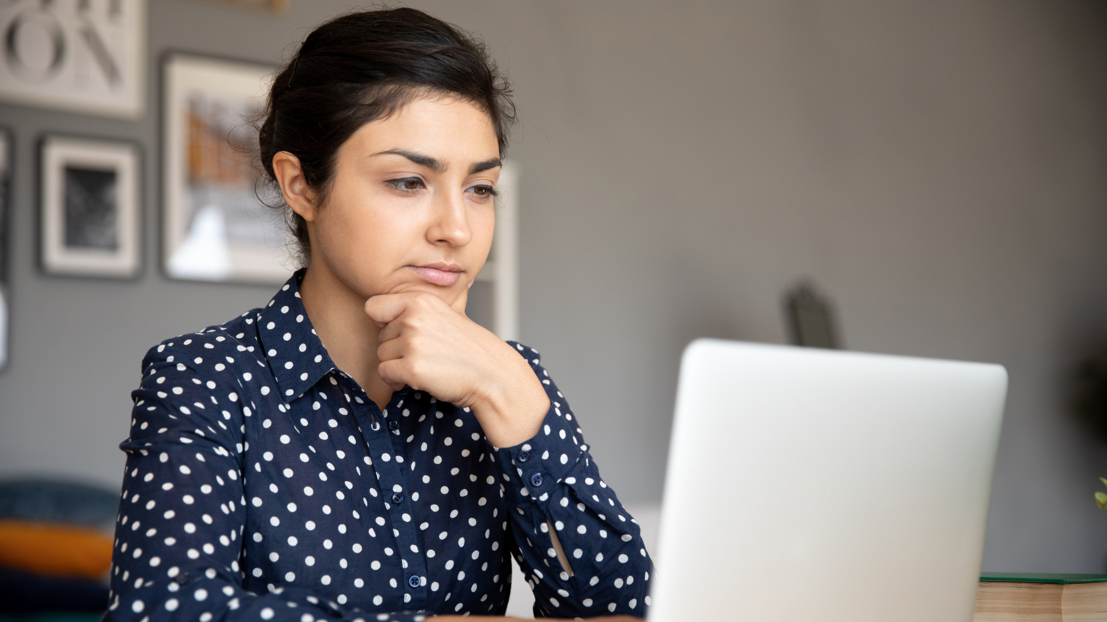 Woman reading computer screen